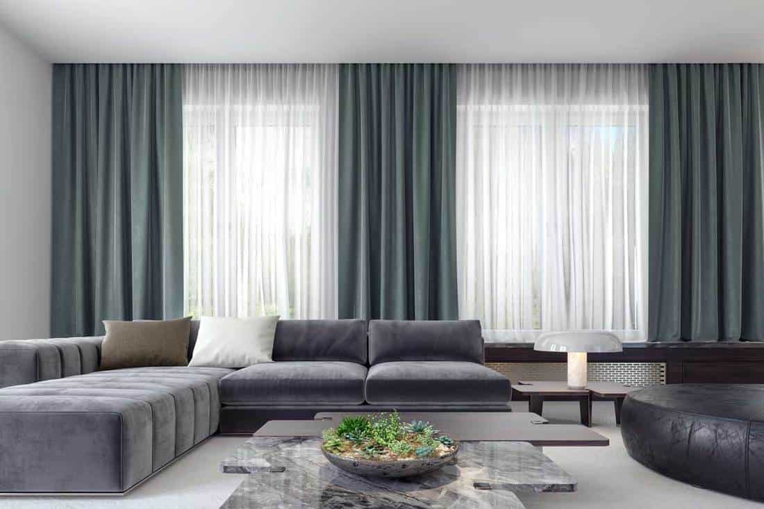 grey-sofa-and-blue-green-curtains-with-with-blinds